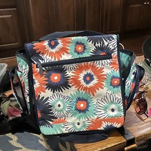 Thirty One multi colored large travel cosmetic bag.